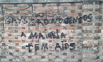 What can teach racist and homophobic graffiti on a school wall?