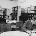 Photograph of Walter Benjanmin working in a library