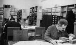 Photograph of Walter Benjanmin working in a library