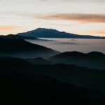 Photograph of mountains in the sunset