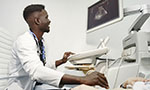 An African doctor makes an ultrasound diagnosis